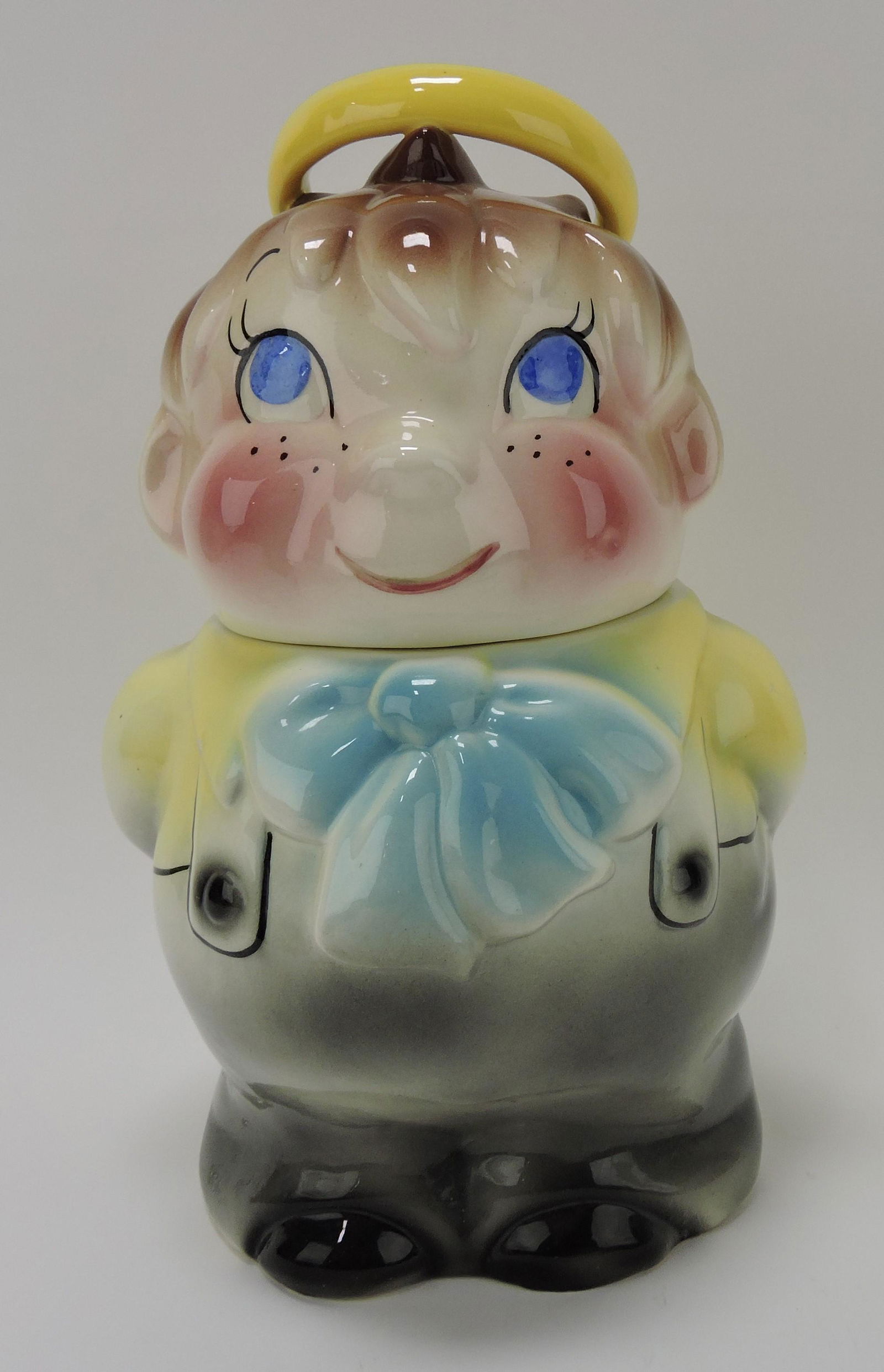 DeForest California Pottery Halo Boy: cookie jar, rim chip to inside rim of base, nick to halo; Flower Family Collection
