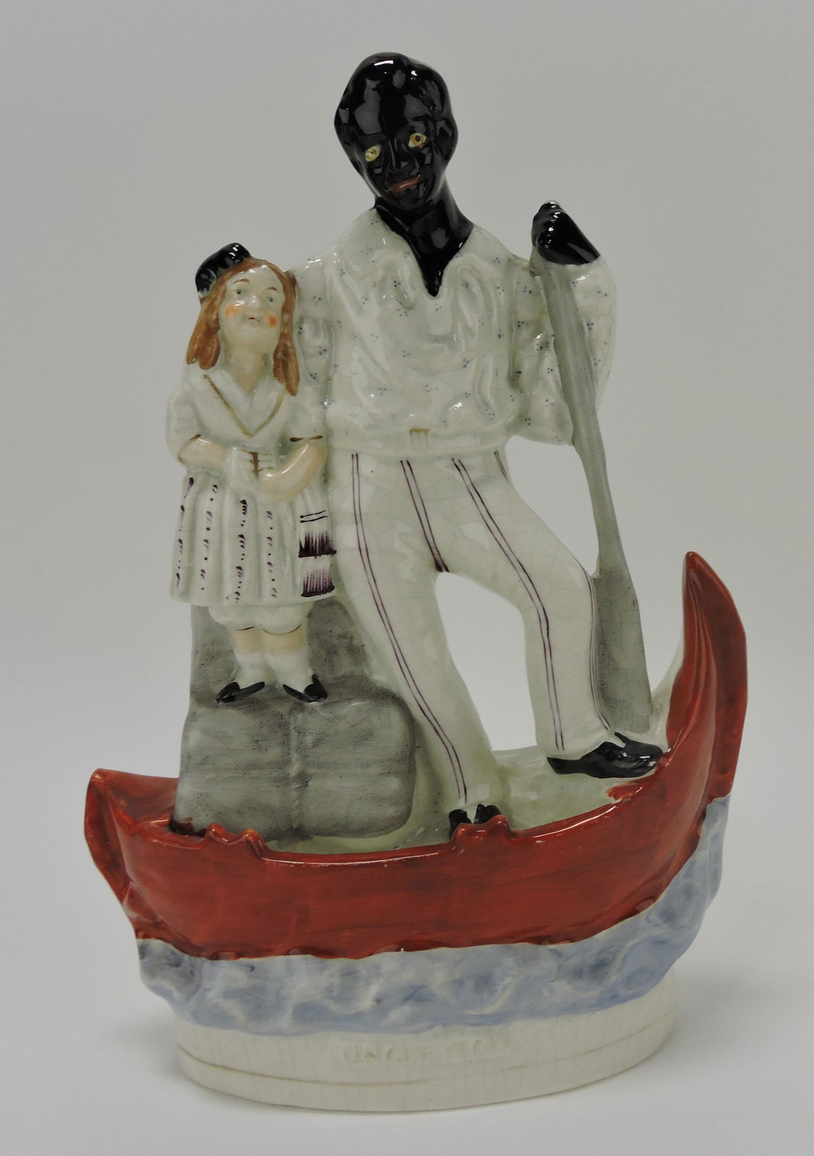 Staffordshire figure of Uncle Tom and (1 of 2)