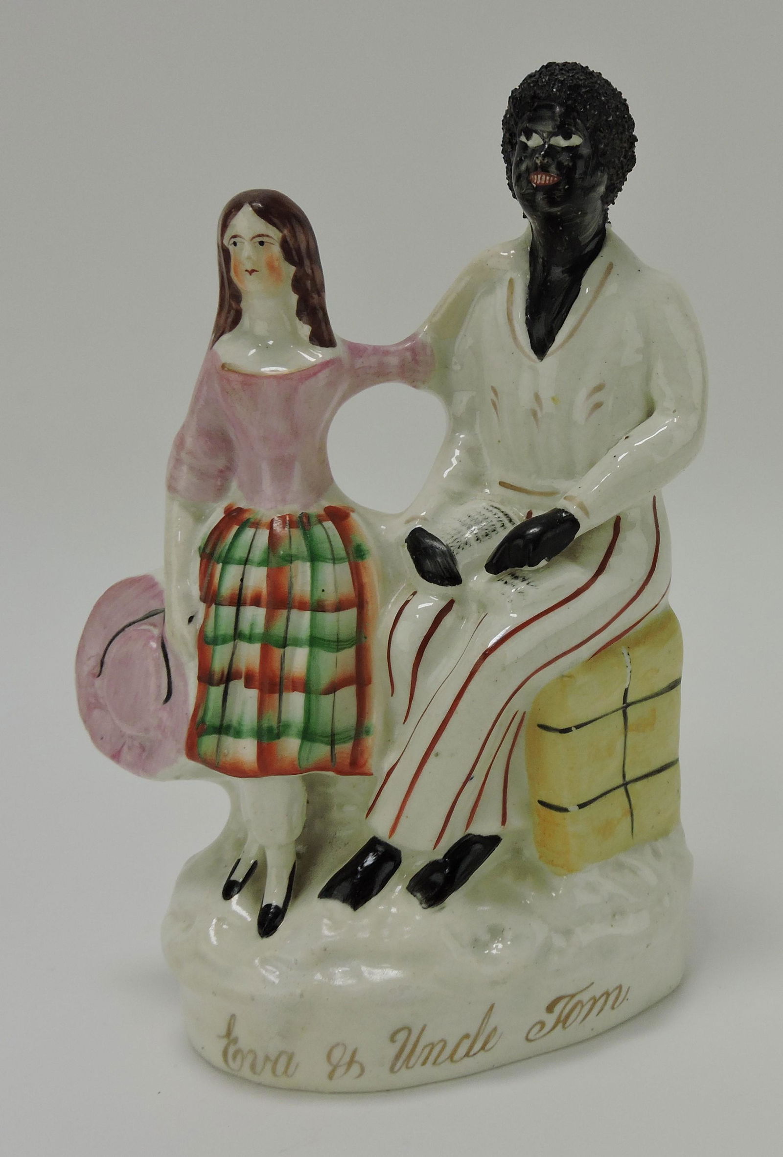 Staffordshire figure of Uncle Tom and (1 of 2)