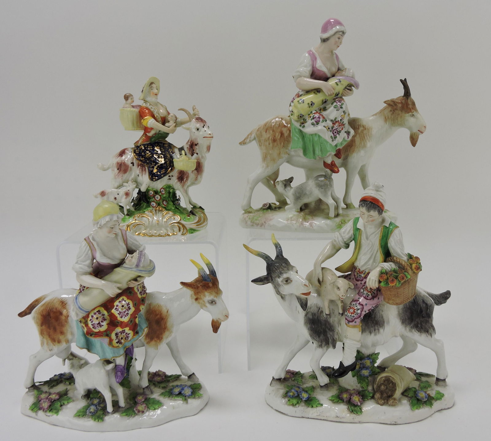 Porcelain lot of 4 goat figure groups, (1 of 1)