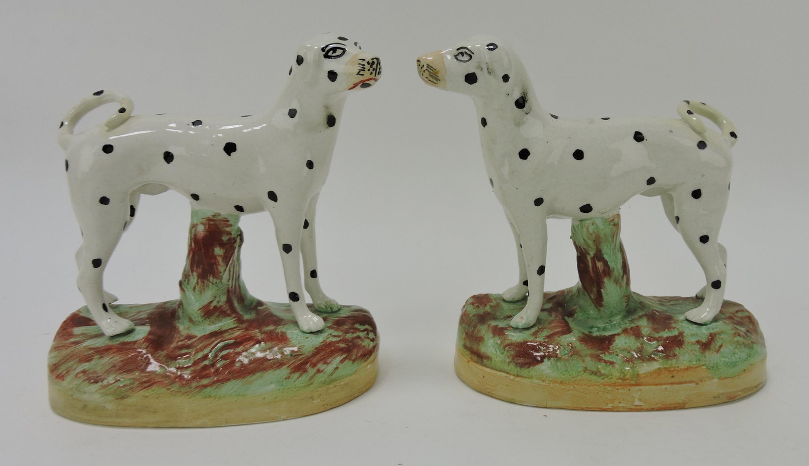 Staffordshire pair of Dalmatians figures,: both with tail repair, 6"