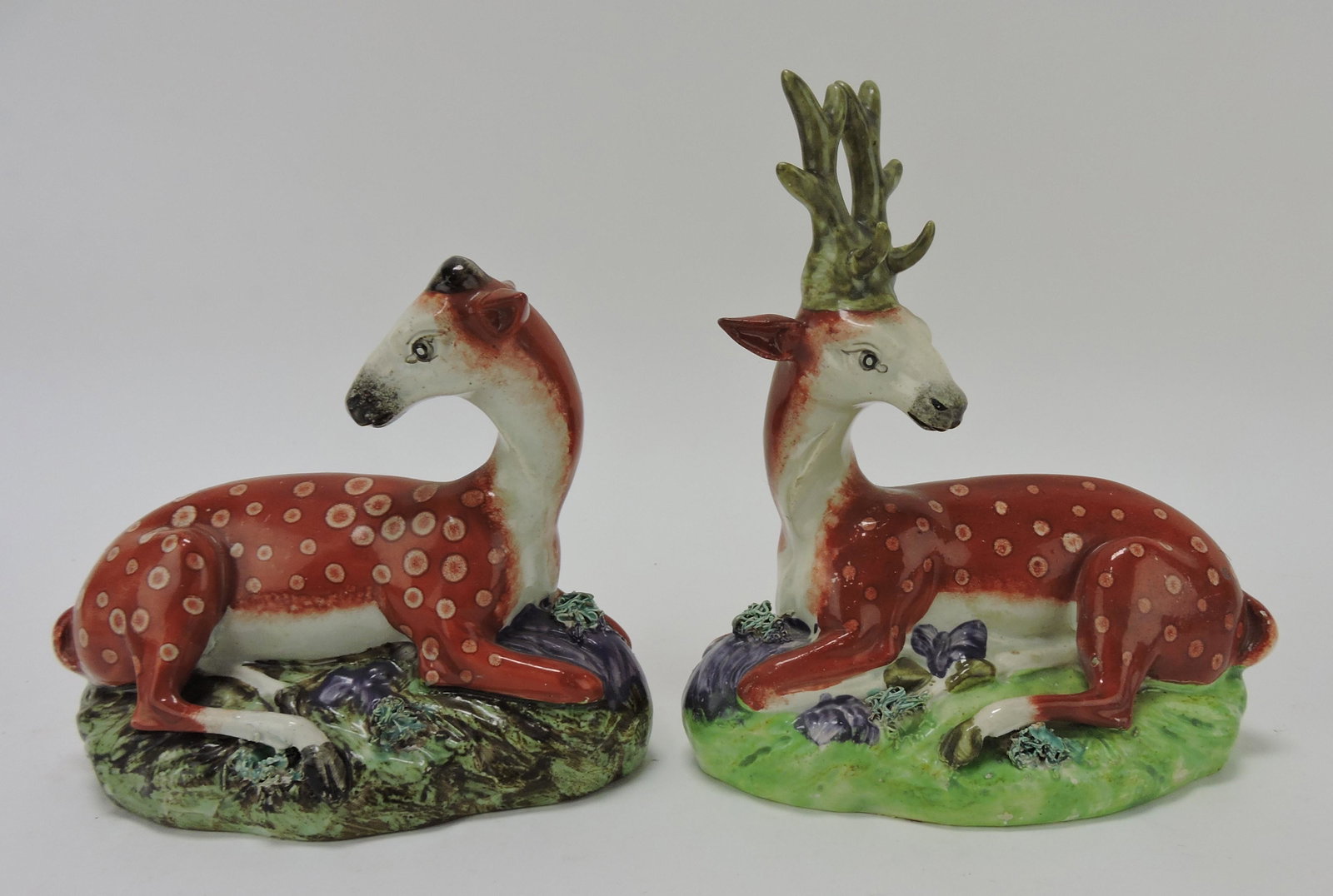 Staffordshire pair of deer figures,: 7" and 5", attributed to Ralph Wood, professional repair to ears