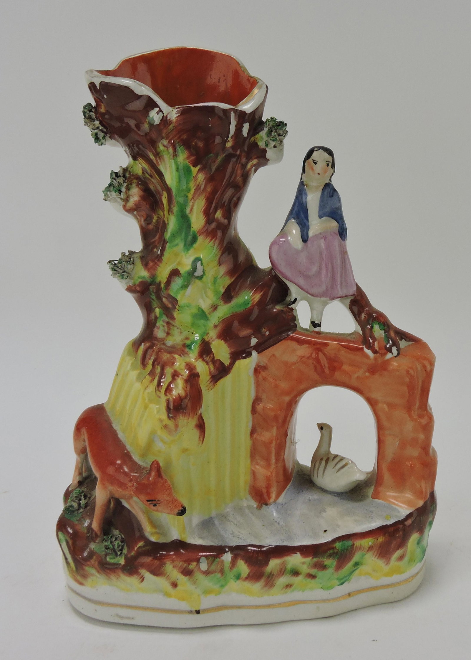 Staffordshire spill vase with girl on: bridge, with swan and fox, 9"