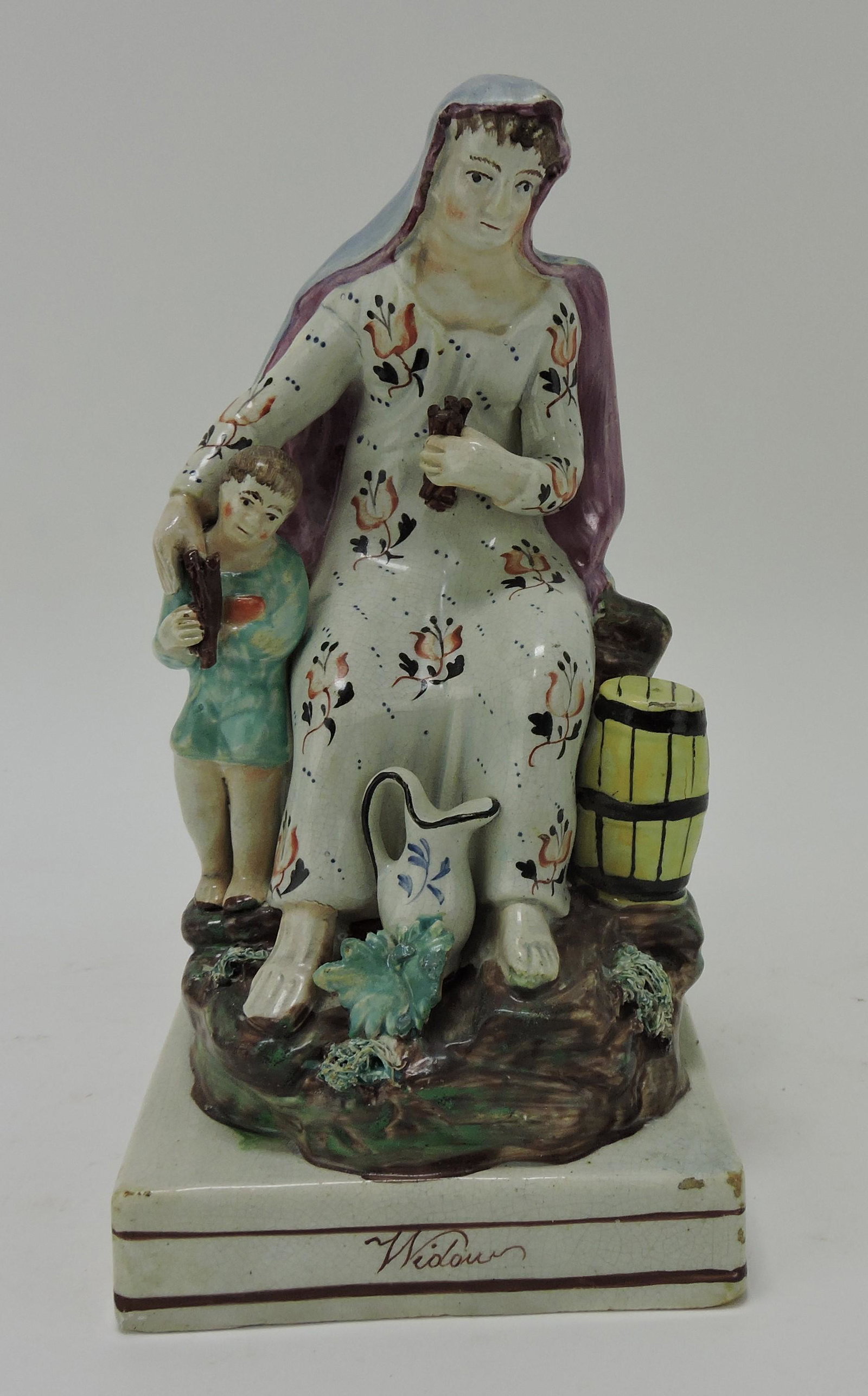 Staffordshire Pearlware 'Widow' figure,: 9", losses and repairs