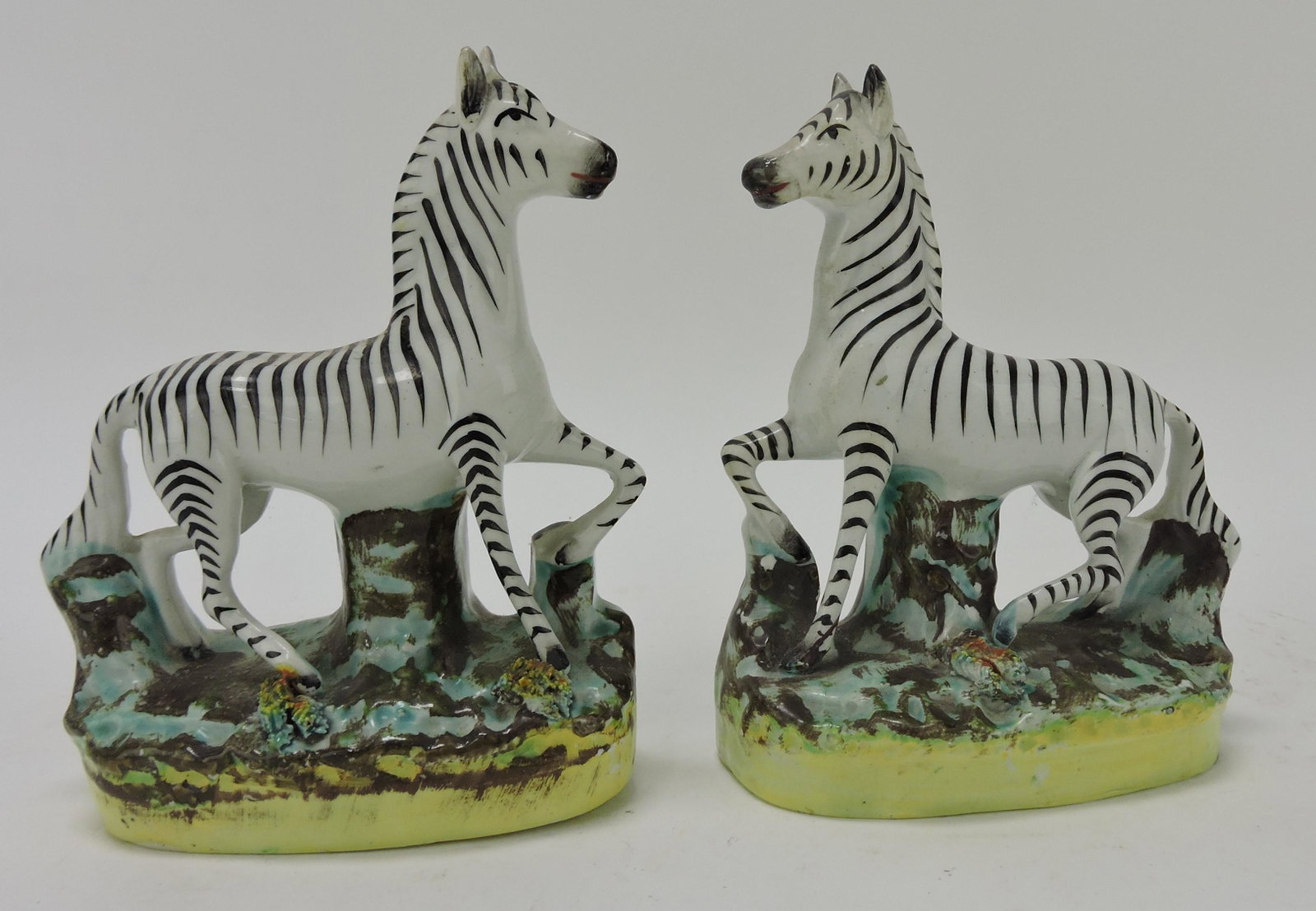 Staffordshire pair of zebra figures,: 6 1/4", professional ear repair