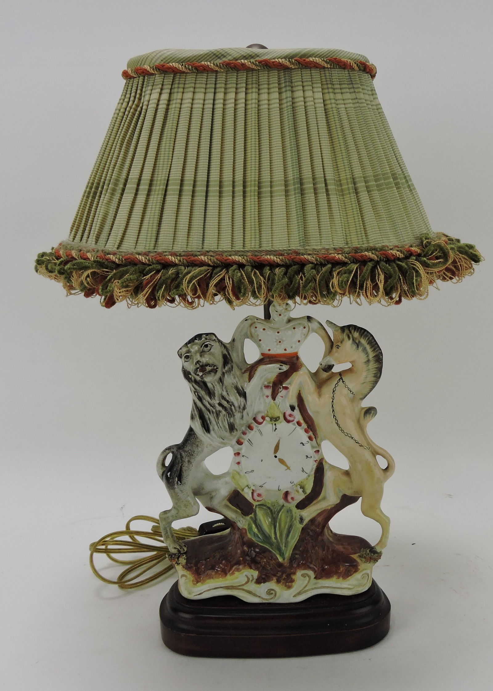 Staffordshire clock figure with lion (1 of 2)