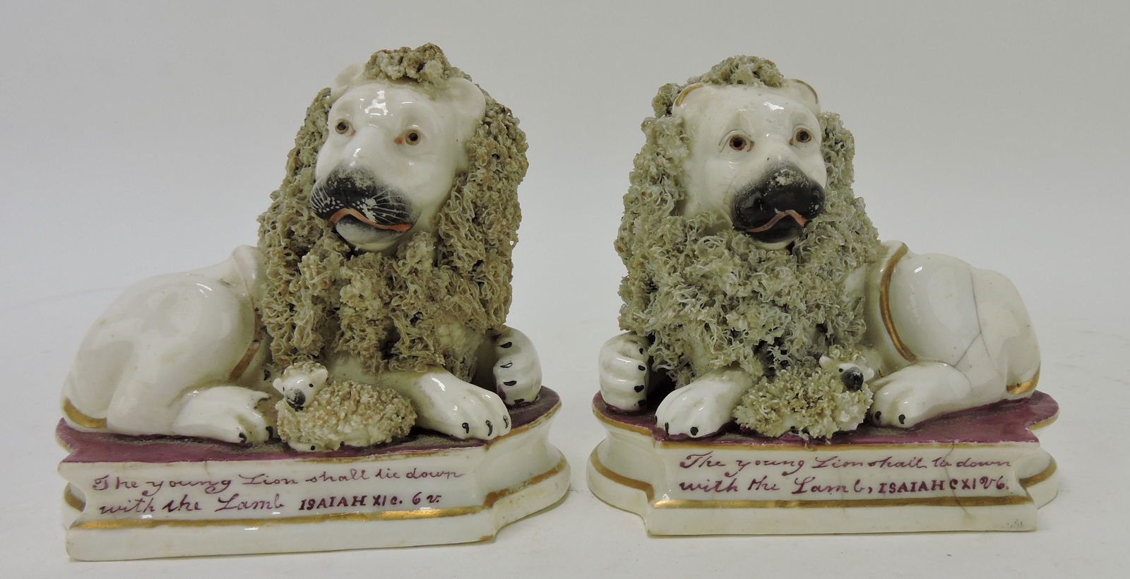 Staffordshire rare pair of lions with (1 of 3)