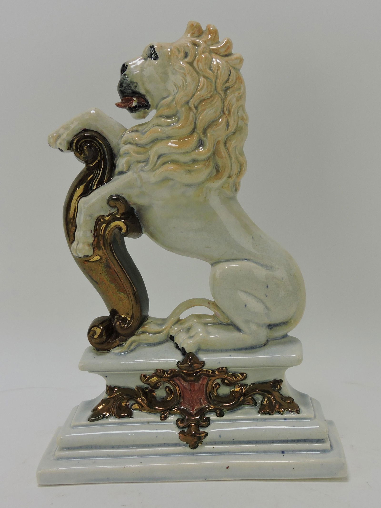 Staffordshire lion on plinth with copper (1 of 2)