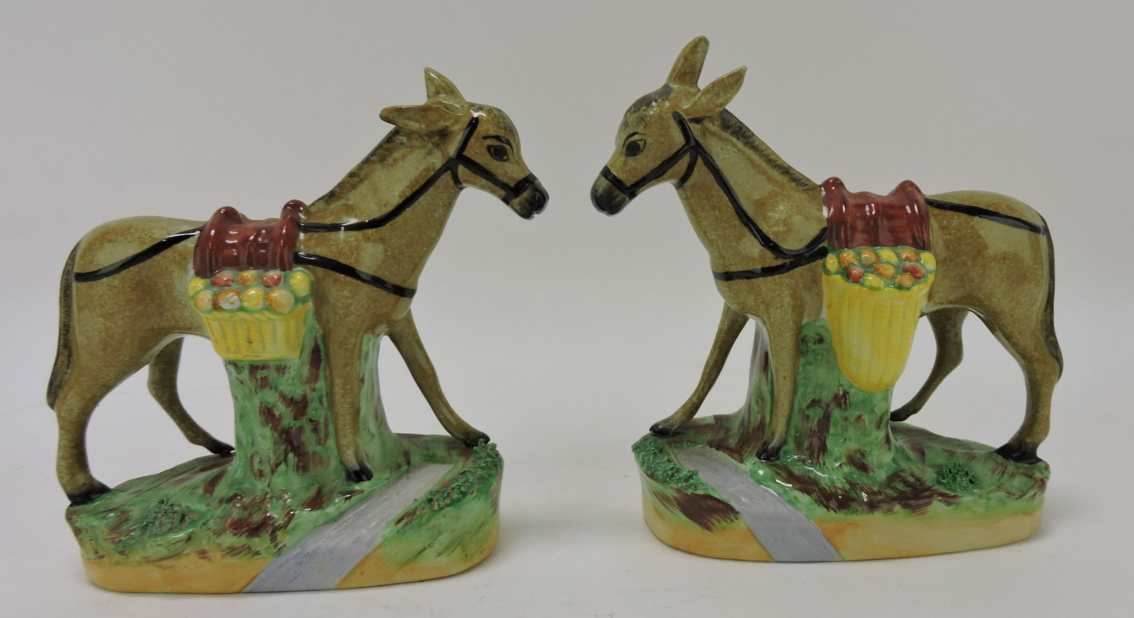 Staffordshire pair of donkey figures, (1 of 2)