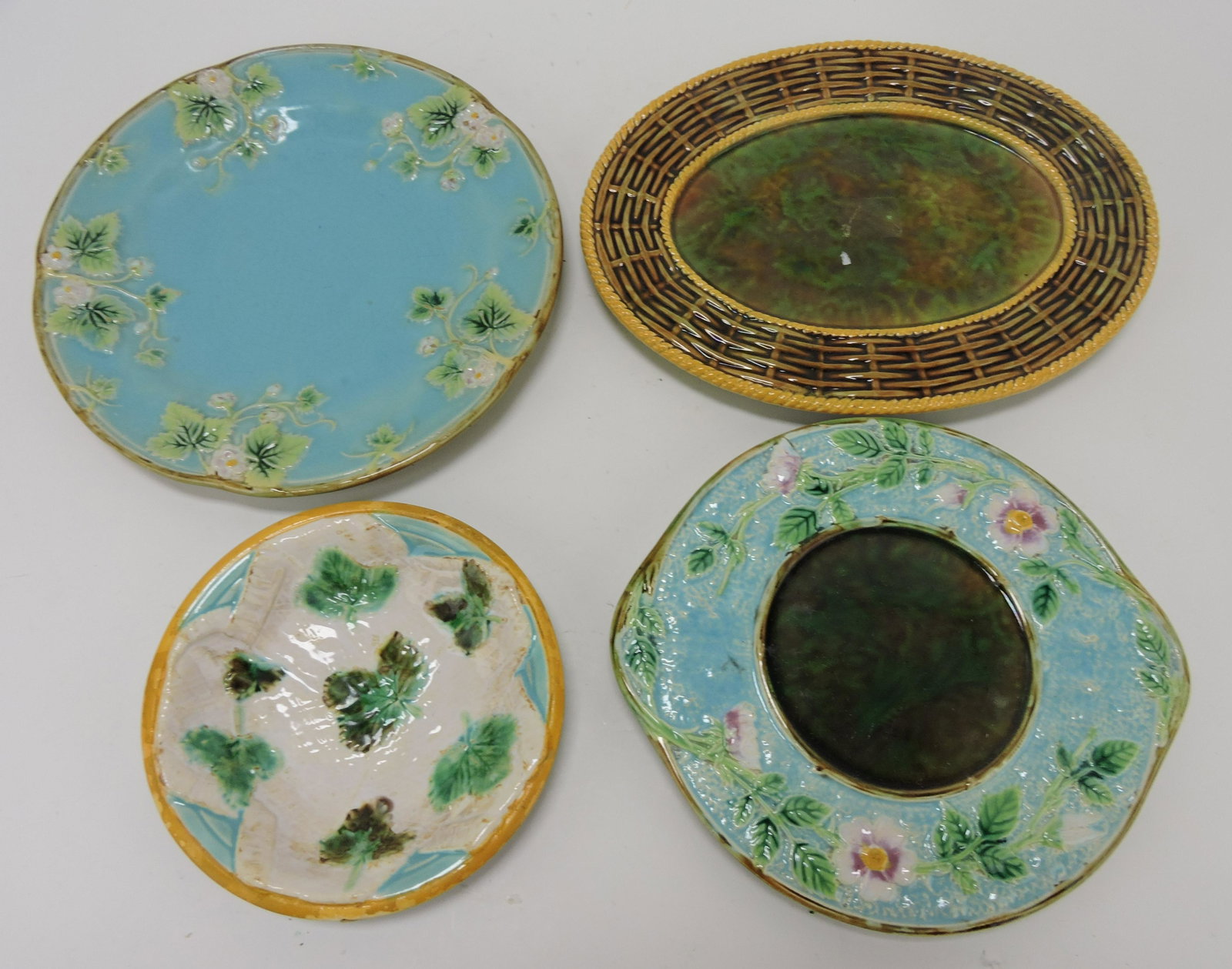 George Jones majolica lot of 4:: plate, sauce dish, & 2 under trays