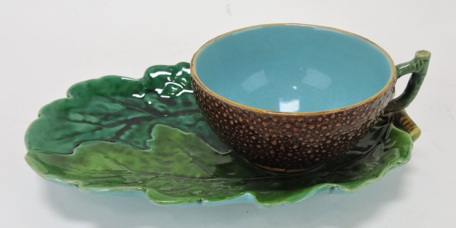 Minton majolica cup and oak leaf saucer: .