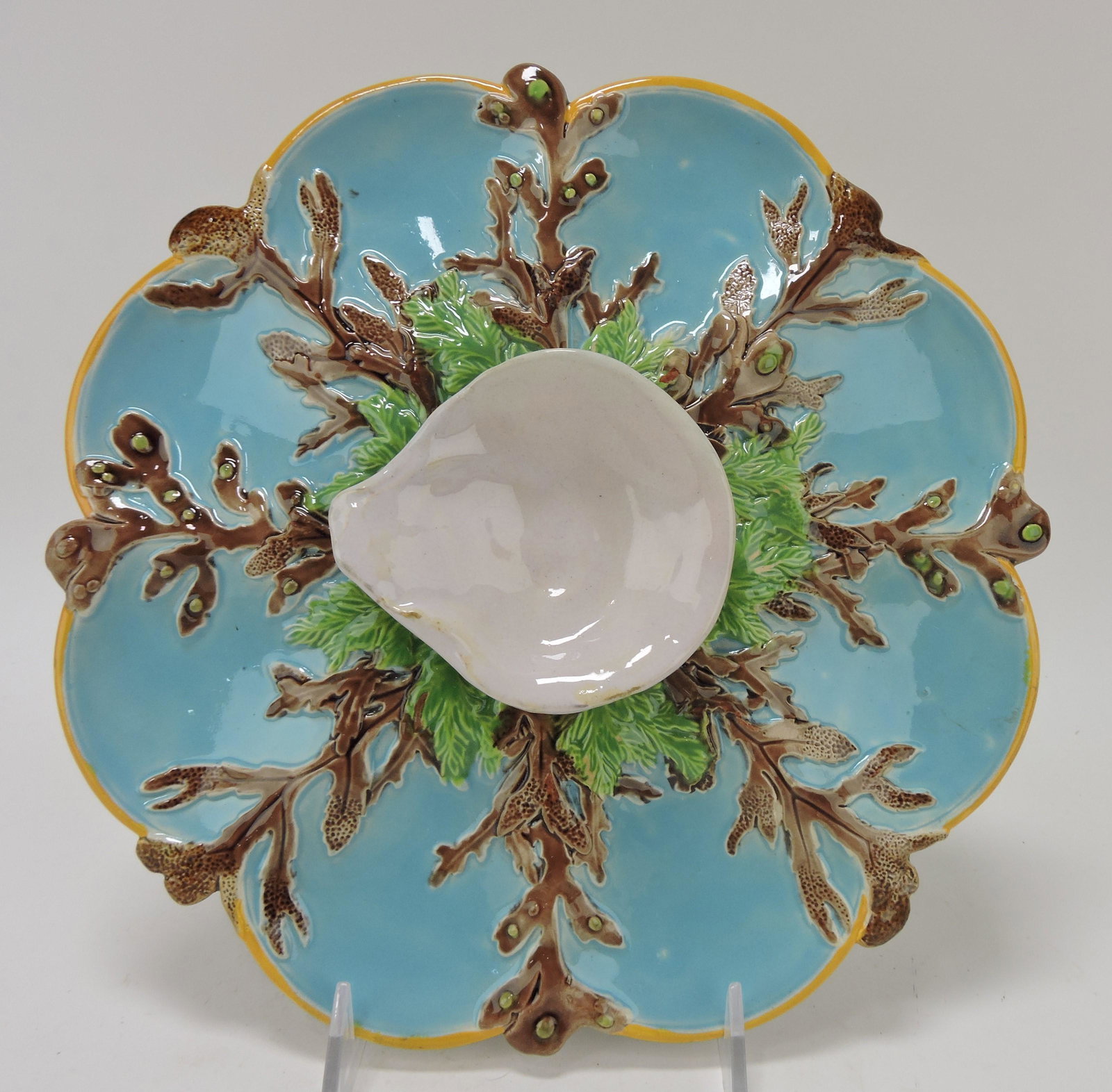 George Jones majolica 8 well oyster: plate with 8 turquoise wells separated by seaweed and white raised center shell, 10 1/4"