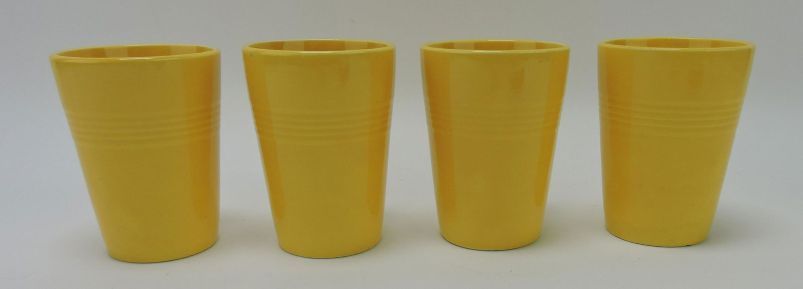 Harlequin set of 4 tumblers, yellow,: nicks to 3
