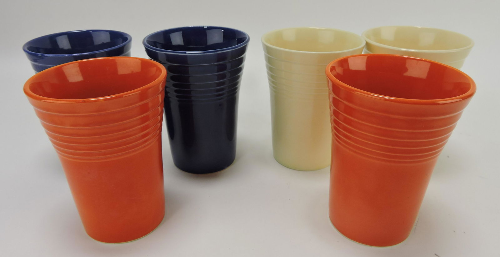 Fiesta water tumbler group: 2 red,: 2 cobalt, 2 ivory