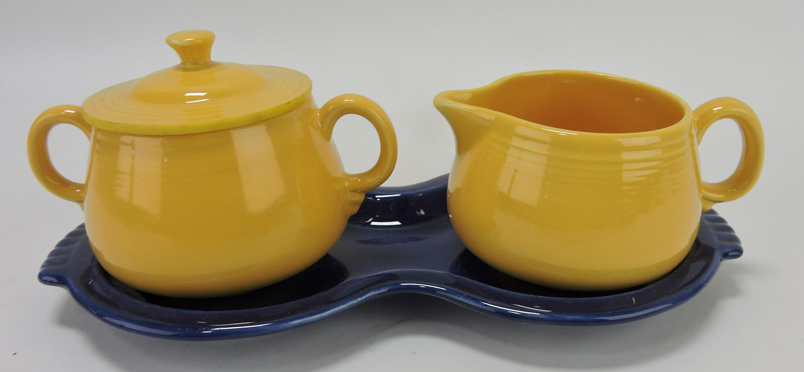 Fiesta yellow cream & sugar on: cobalt figure 8 tray