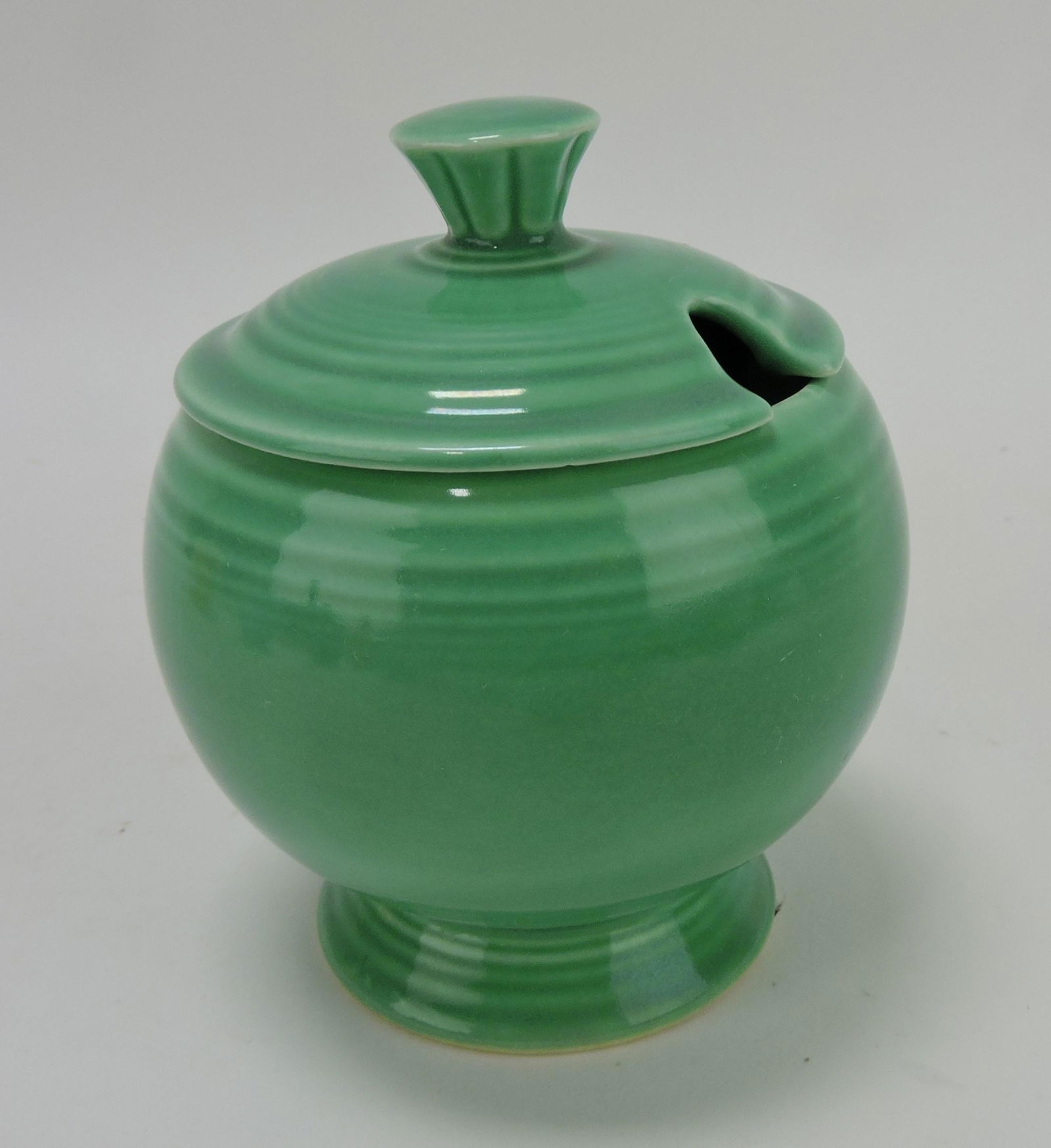 Fiesta marmalade, green, rim nick to: lid & finial