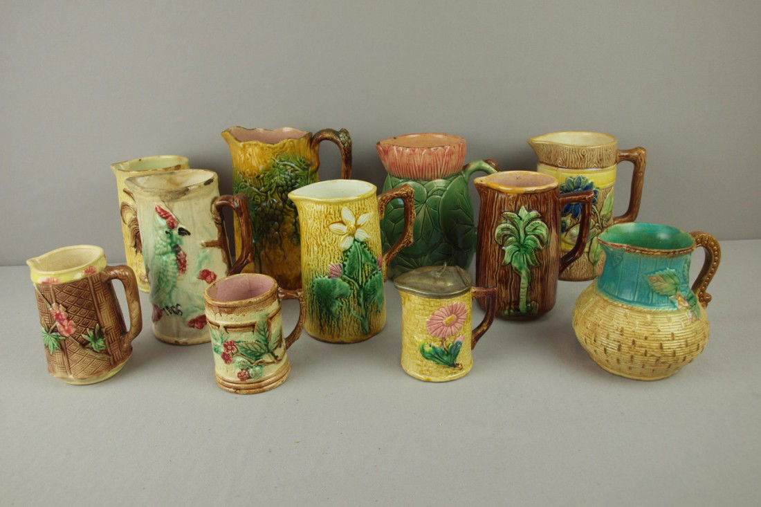 Majolica lot of 11 pitchers, various condition: Majolica lot of 11 pitchers, various condition