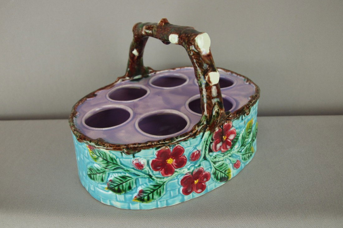 Majolica egg basket with floral motif, lavender to: Majolica egg basket with floral motif, lavender top and branch handle, 8"w, nice color