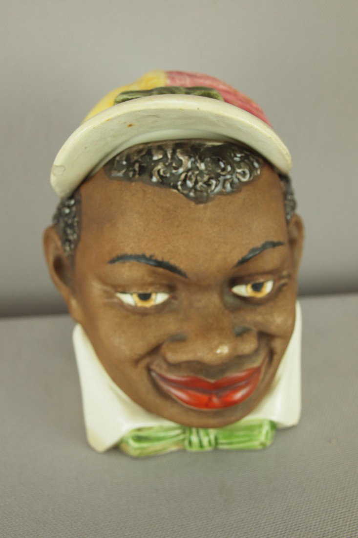 Continental blackamoor jockey figural majolica hum: Continental blackamoor jockey figural majolica humidor, rim chip to lid, 5"