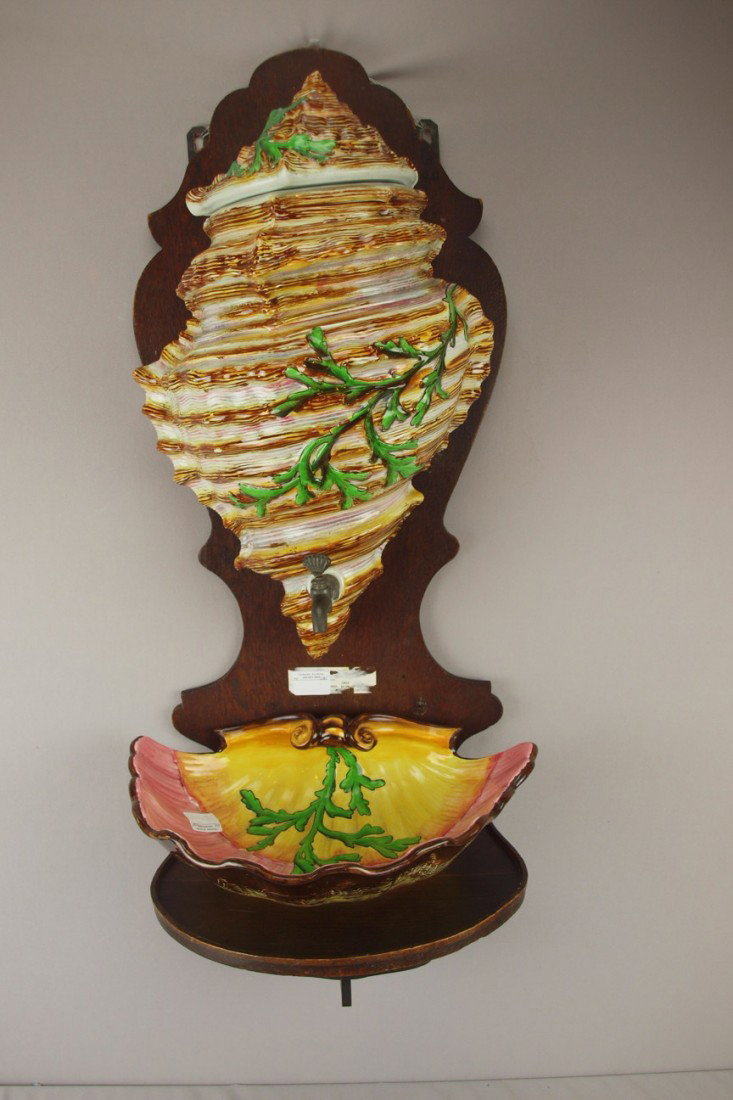 SARREGUEMINES majolica lavabo in the form of a she: SARREGUEMINES majolica lavabo in the form of a shell with cover and shell shaped basin on oak backboard, 15 1/2"w, 37"h, professional repair to lid rim
