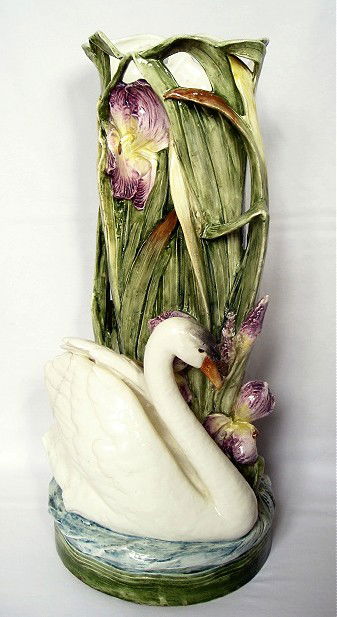 Monumental vase/umbrella stand with swan on water: Monumental vase/umbrella stand with swan on water with leaves and iris, 23 1/2", good color and detail, loss of tail feathers, hairline to wing