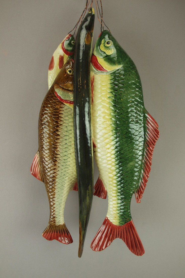 Majolica figural wall plaque with three fish and a: Majolica figural wall plaque with three fish and an eel, outstanding color and detail, chip to tip of tail of one fish, 24"l,