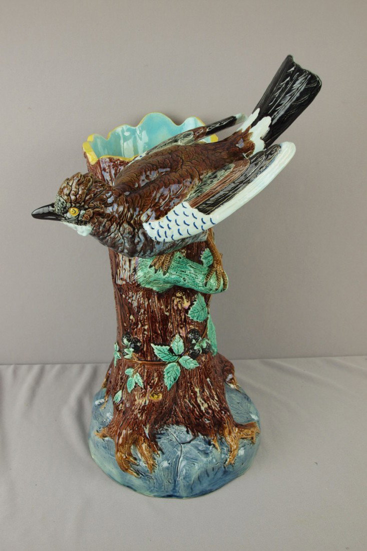 HOLDCROFT majolica umbrella stand in the form of a: HOLDCROFT majolica umbrella stand in the form of a tree trunk with a large bird, 20 1/2"h, professional repair to bird's beak and base rim, great color and detail, rare form