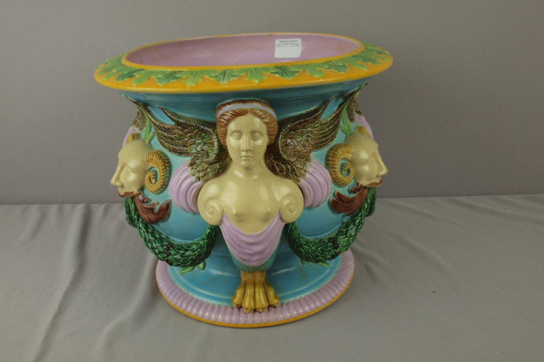 GEORGE JONES majolica jardiniere with winged ladie: GEORGE JONES majolica jardiniere with winged ladies and masks, 13"d, 11"h