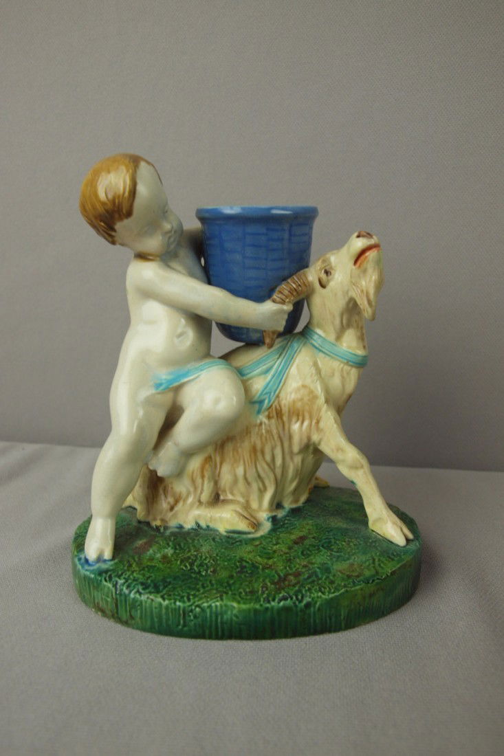 ROYAL WORCESTER majolica figural toothpick holder: ROYAL WORCESTER majolica figural toothpick holder in the form of a putti and goat with basket, professional repair to basket rim, goat horn and leg, 4 3/4"h