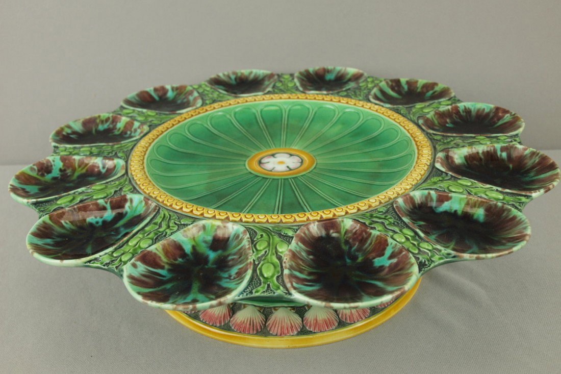 MINTON rare revolving oyster stand molded with 12 : MINTON rare revolving oyster stand molded with 12 mottled oyster wells andfloral center on base with shells surrounding rim, shape no. 1355, date code for 1870, extremely rare form, 15 1/2"d, 4"h, pro