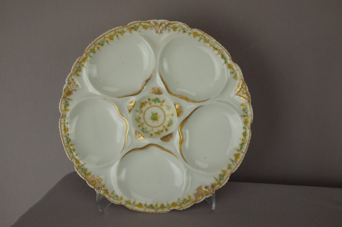 Theodore Haviland porcelain 5 well oyster plate wi: Theodore Haviland porcelain 5 well oyster plate with floral rim, 8 1/2"