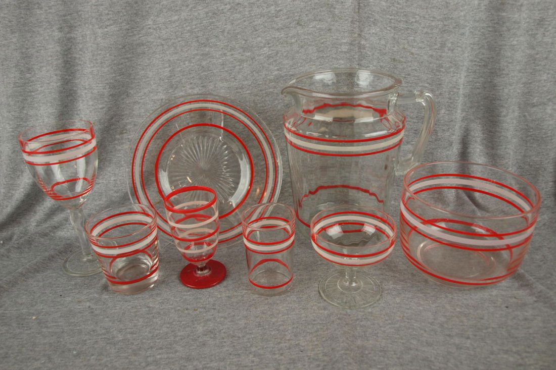 Glass ringware set with red and white rings - pitc: Glass ringware set with red and white rings - pitcher, 13 water goblets, sherbert, 11 whiskey glasses, 2 ice buckets , 7 small goblets, 6 juice tumblers and 8 plates