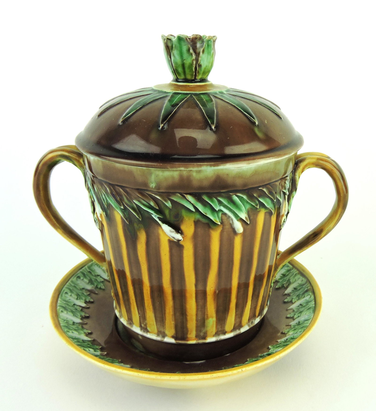 Rare Wedgwood Majolica Twin Handled: 18th Century French style Jar & Cover c.1870, the body decorated with upright stripes of amber and brown with green leaves to the top, the domed lid decorated with stylised leaves, a leafage finial, a