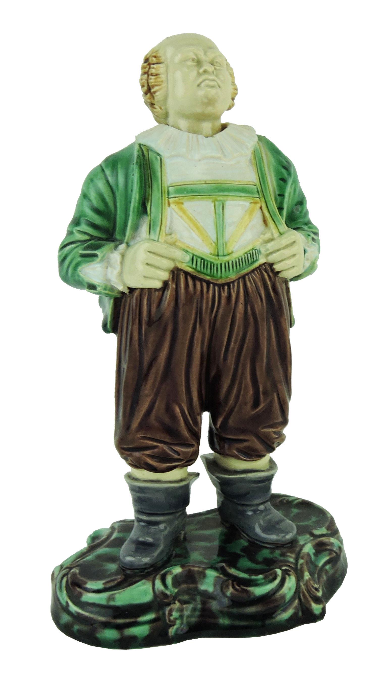Very Rare Minton Majolica ‘Easy Johnny’: Nodding Head Figural c.1865, shape no. 75, modelled as gentleman in country dress with his fingers through his braces all upon a mottled base, 7". Only two known examples. Catalogued and curated by Ni