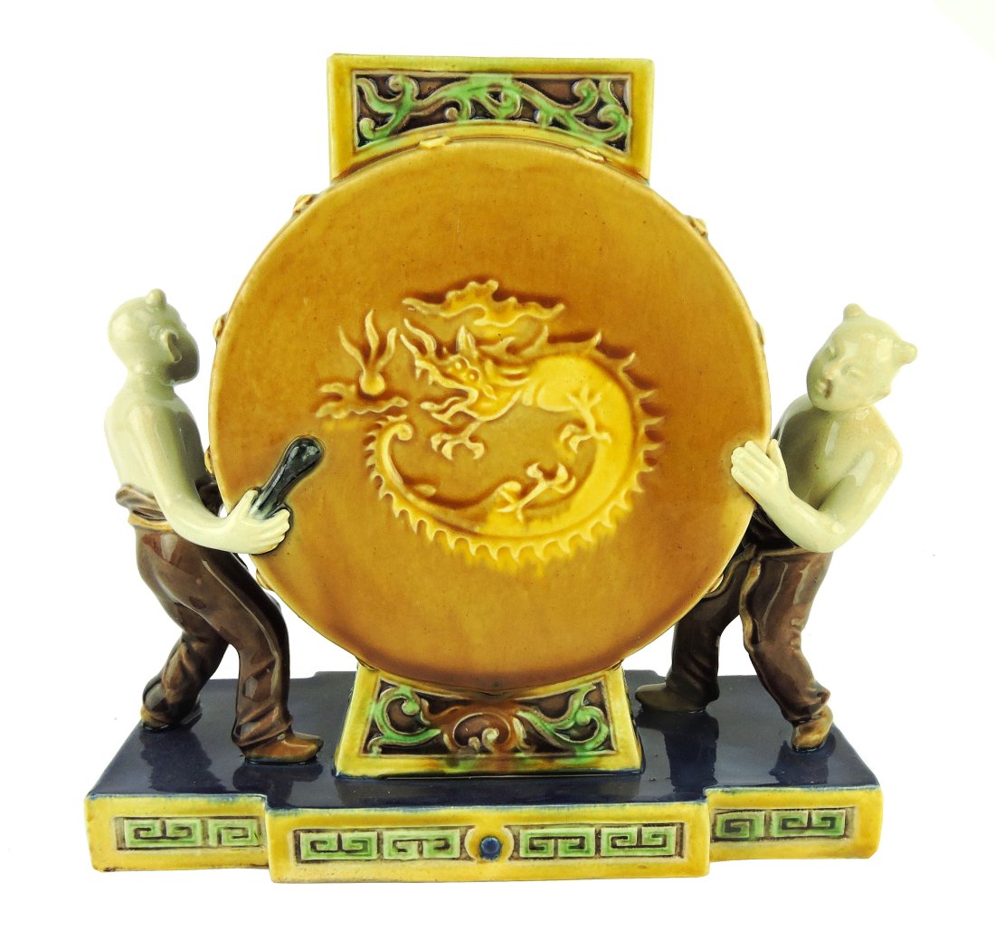 Very Rare Minton Majolica Majolica: Aesthetic Movement c.1875 modelled as a Chinese drum with a drummer at each end, all upon a shaped pedestal base with Chinese motif to the edges, shape no. 1896, 6 1/2"h, 7"w. Although this shape appe