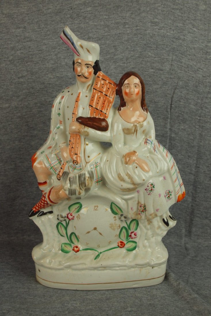 Staffordshire clock statue with man and woman, 13 : Staffordshire clock statue with man and woman, 13 1/2"