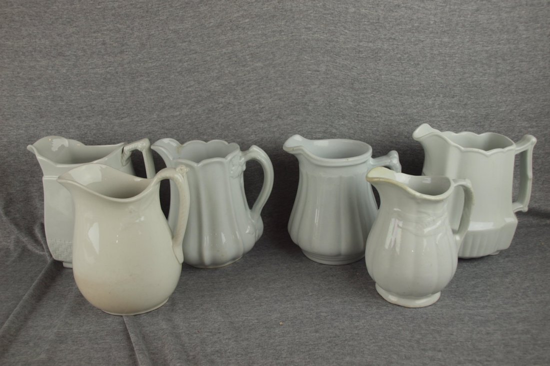 Lot of 6 white ironstone pitchers, 7 1/2" average,: Lot of 6 white ironstone pitchers, 7 1/2" average, hairline to 2