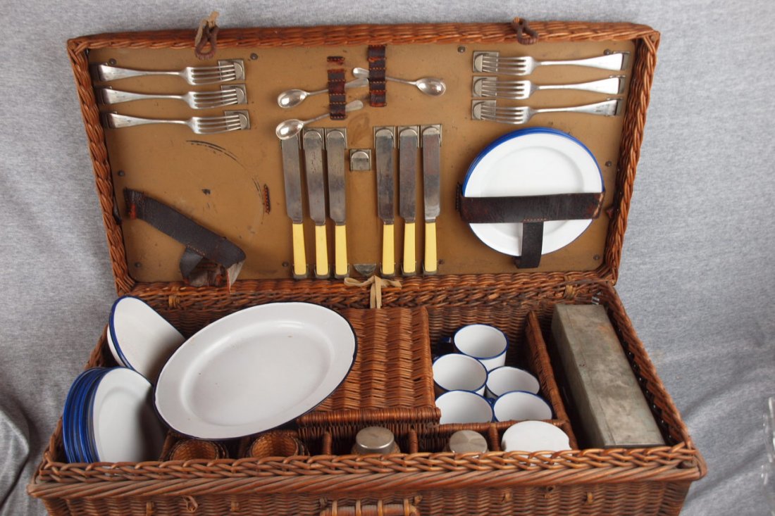 Wicker picnic basket with graniteware plates and: Wicker picnic basket with graniteware plates and cup and assorted accessories, nice set includes - tin box, 6 granite mugs, 5 granite cups & 6 saucers, 2 granite oval trays, 13 granite plates, 6 wicke