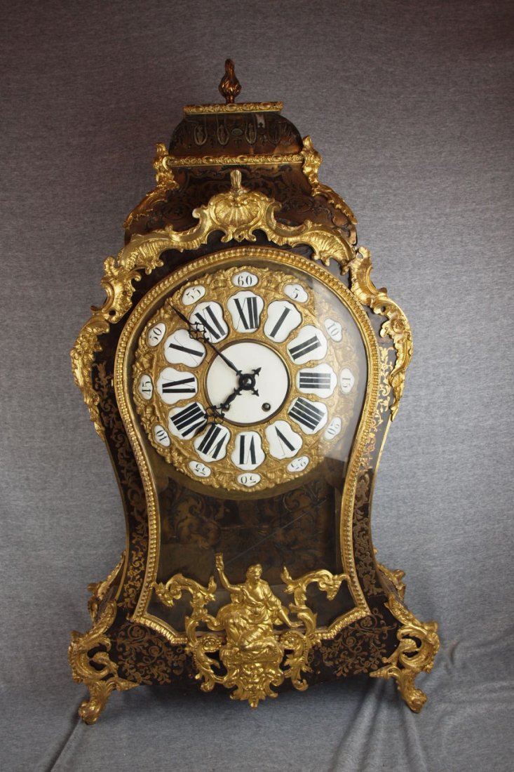 French bracket clock with brass inlay and ormolu,: French bracket clock with brass inlay and ormolu, 38"h, 22"w, side glass broken, front door latch missing.