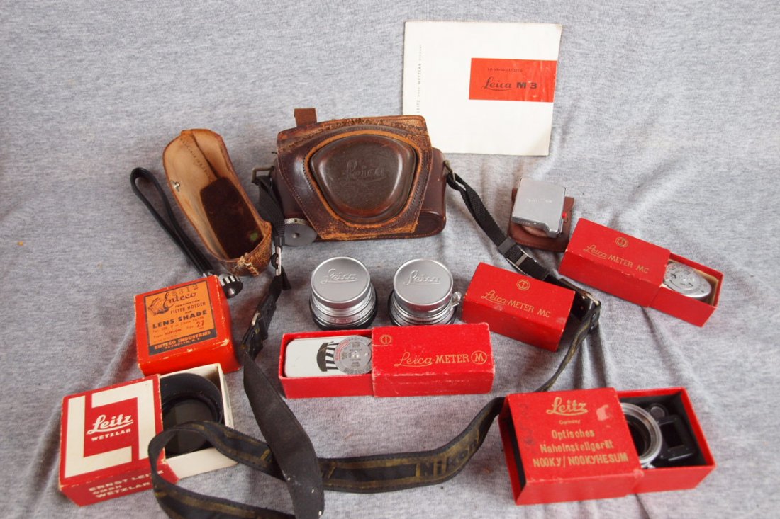 Leica M3 German 35mm camera with 2 extra lenses,: Leica M3 German 35mm camera with 2 extra lenses, meters, owners manual and accessories, lens on camera #1188439 f9cm 1:4 (dented front rim); extra lens #1154096 f5cm 1:2; additional lens #1179197 f3.5