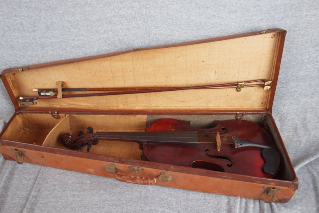 Violin and case: Violin and case, tag inside "Medio Fino"