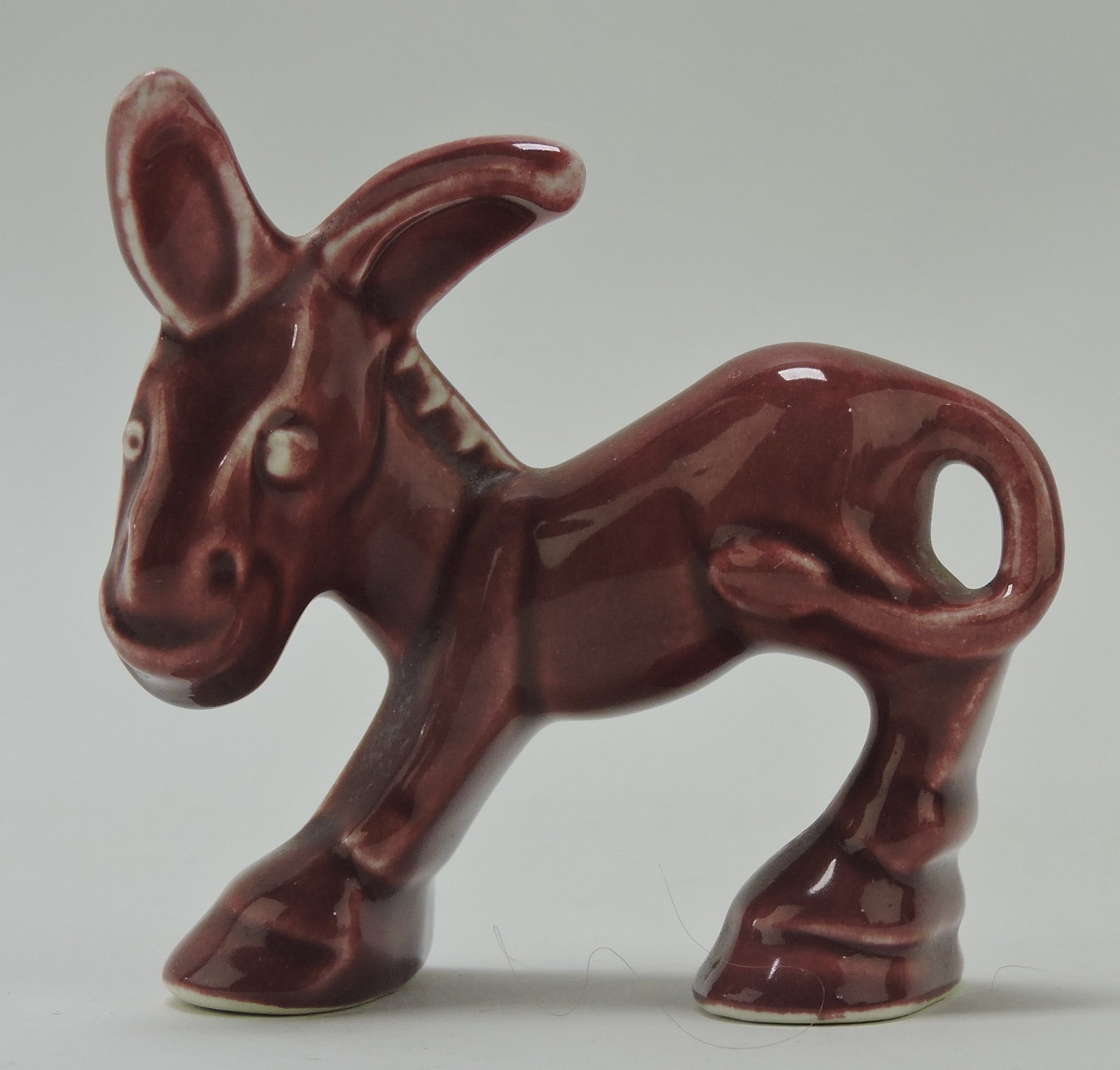 Harlequin animal, donkey, maroon: .