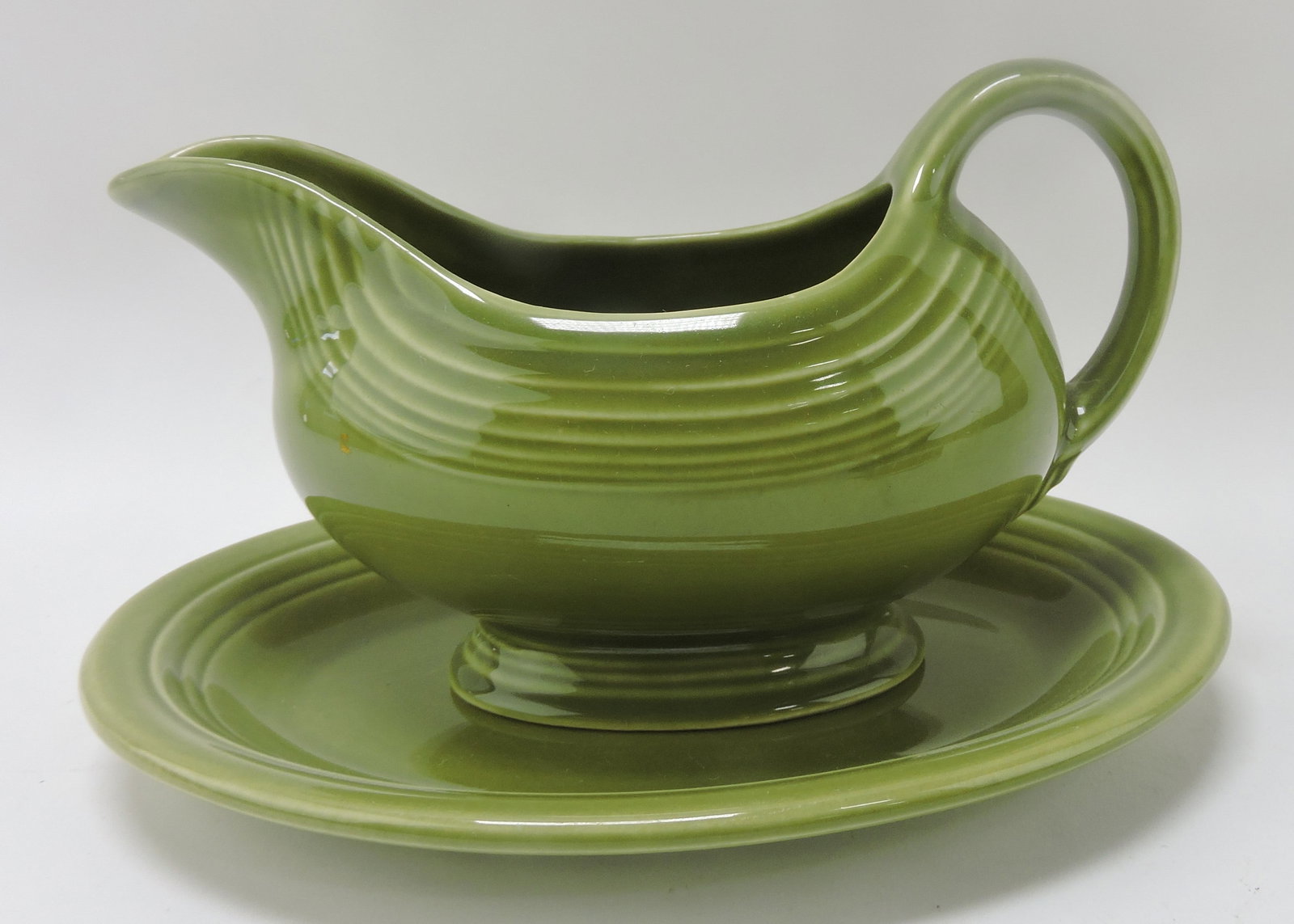 Fiesta Ironstone sauce boat and stand,: turf green