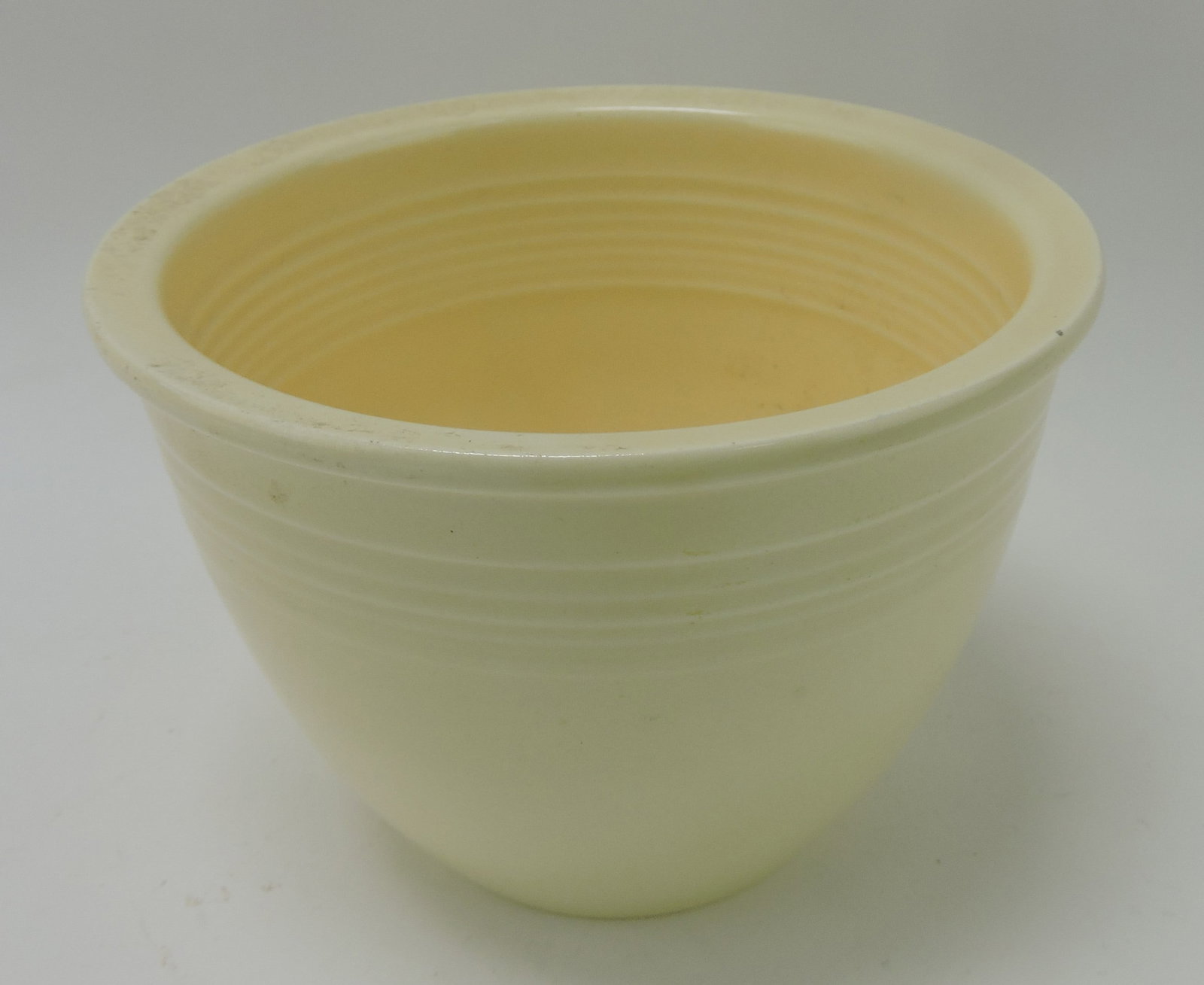 Fiesta #1 mixing bowl, ivory, inside rings,: rim nick