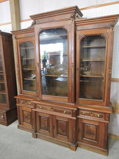 Walnut Victorian triple door bookcase/: china cabinet, 93"h, 78"w, 19"d, two pieces, some moisture damage to bottom of top section