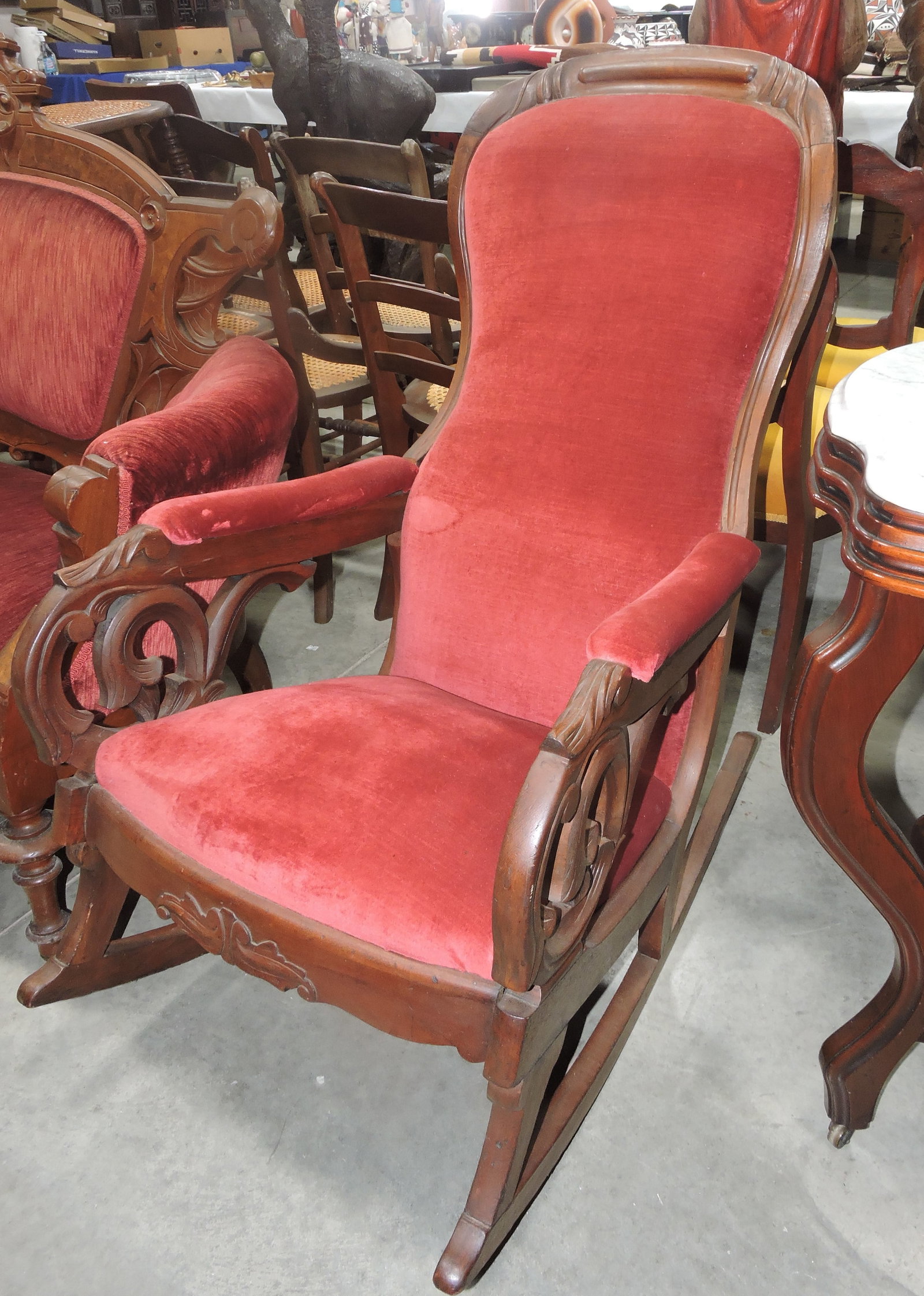 Walnut finger carved arm rocker: .