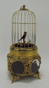 German brass bird cage music box: with bird atop a beveled glass cage, 14", works