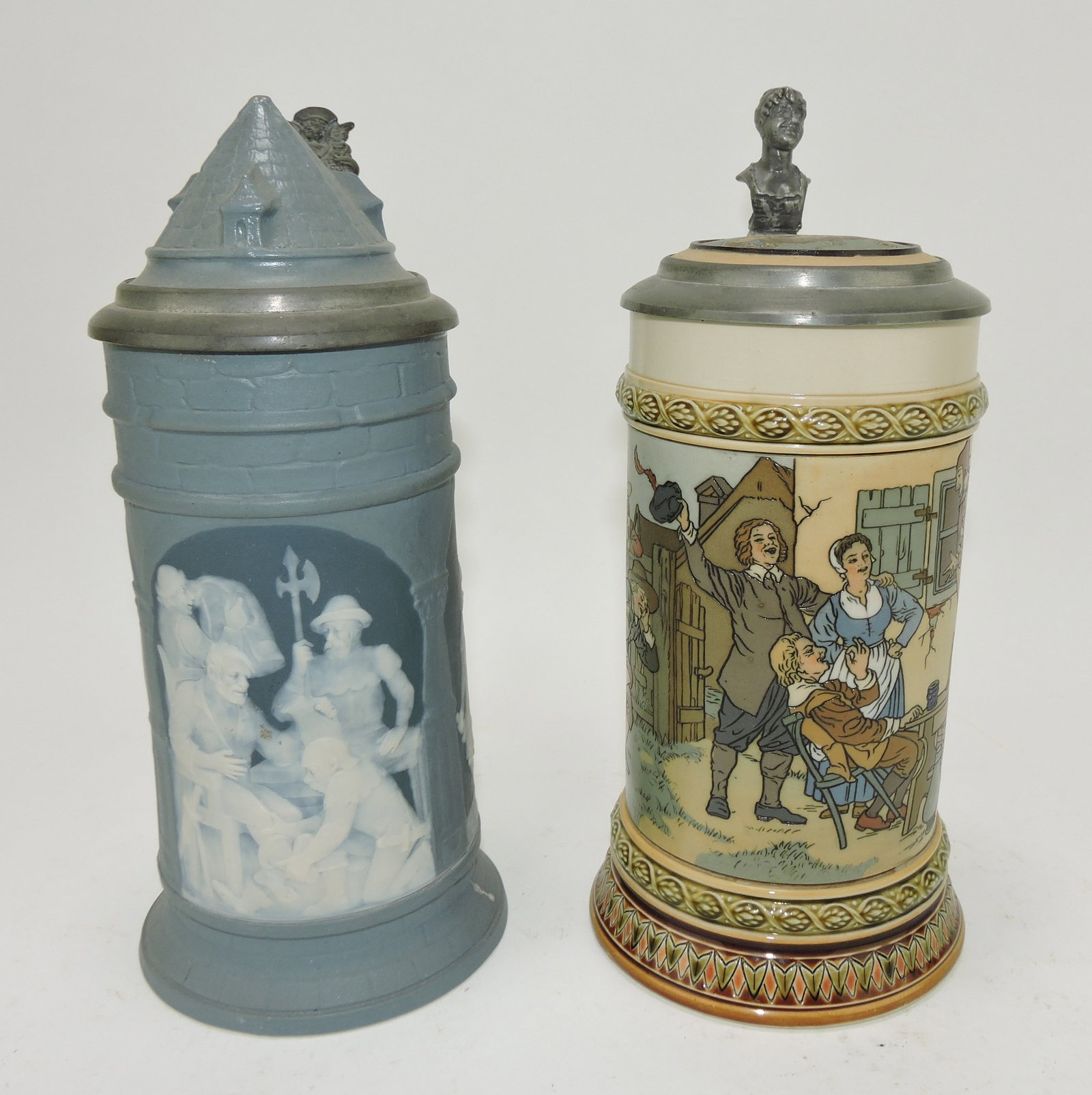 Mettlach lot of 2 steins, #2652 1/2L,: cameo archway scenes AND #2582 1/2L, jester on table