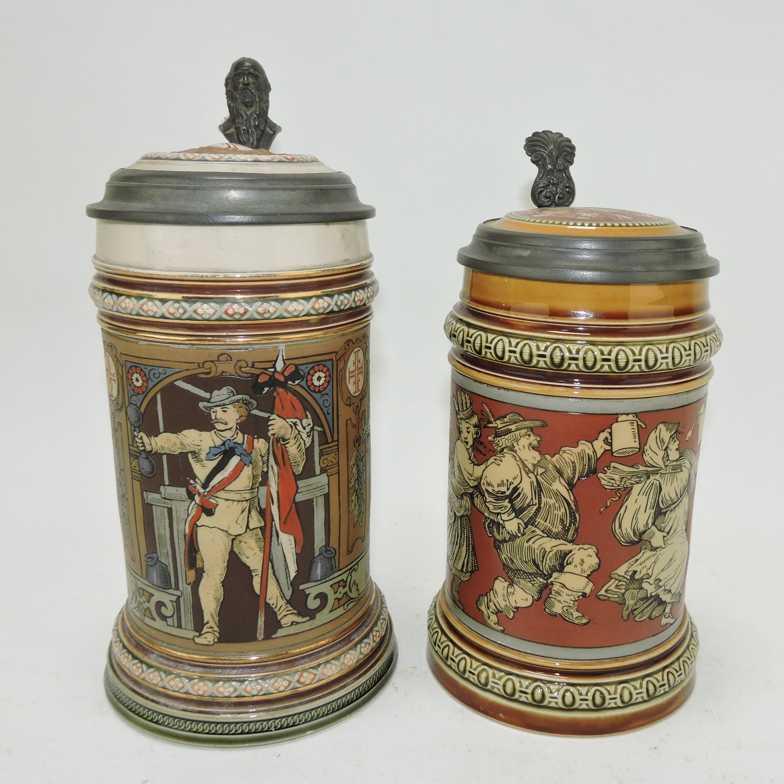 Mettlach lot of 2 steins, #1914 1/2L,: gymnast AND #2057 1/2L, dancers
