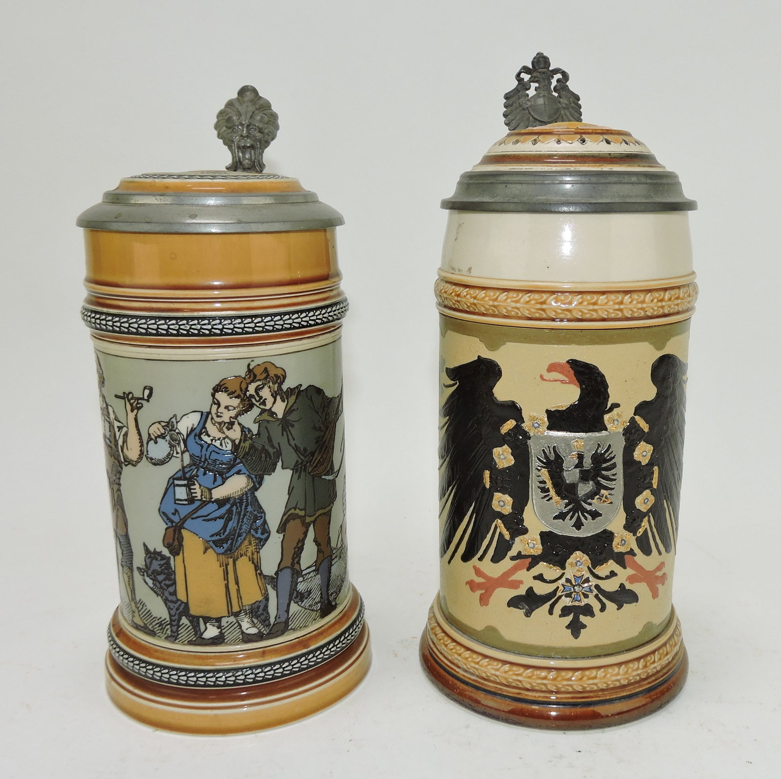 Mettlach lot of 2 steins, #1164 1/2L,: indoor scene AND #2204 1/2L. eagle